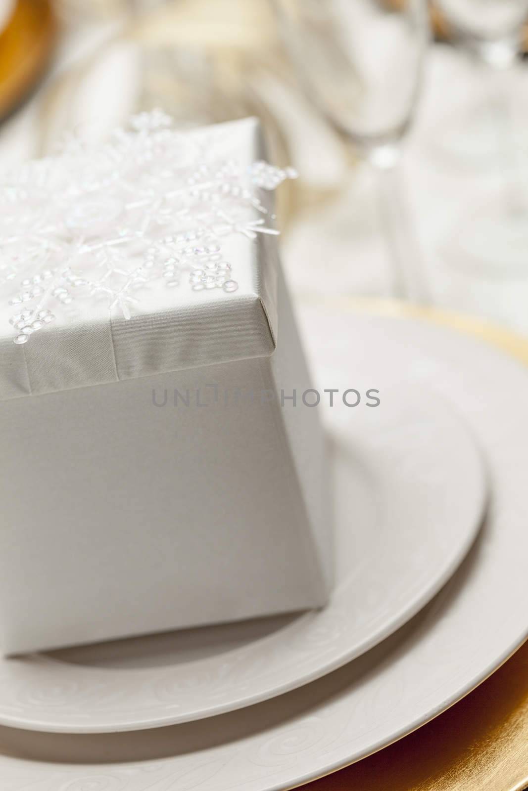 Beautiful Christmas Gift with Place Setting Abstract at Table.
