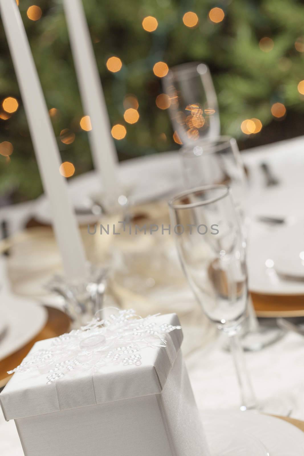 Beautiful Christmas Gift with Place Setting Abstract at Table.