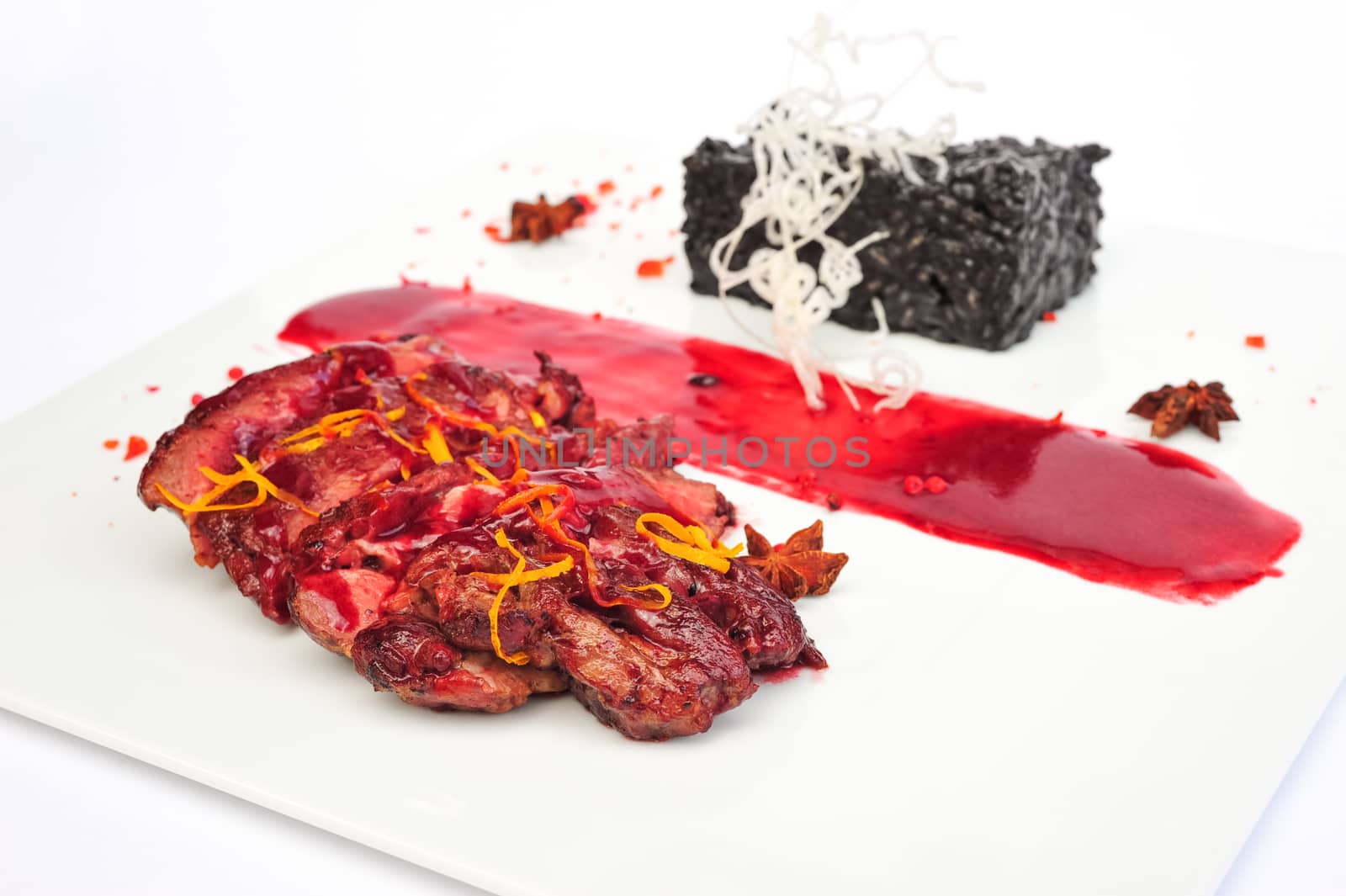 Sliced medium rare grilled Steak Ribeye served on white plate