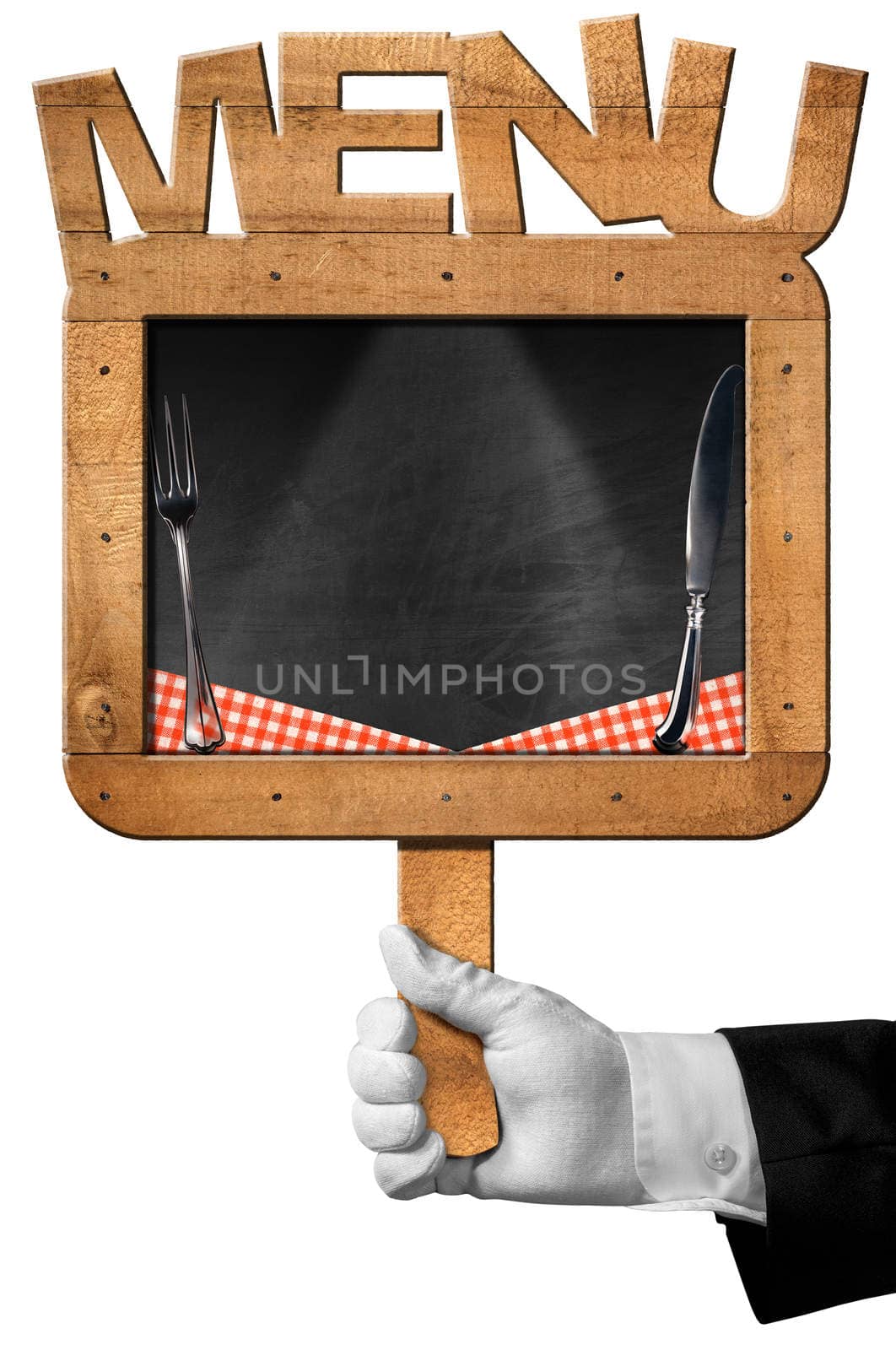 Hand of chef with white glove holding an old empty blackboard with wooden frame with text menu, silver cutlery and checkered tablecloth