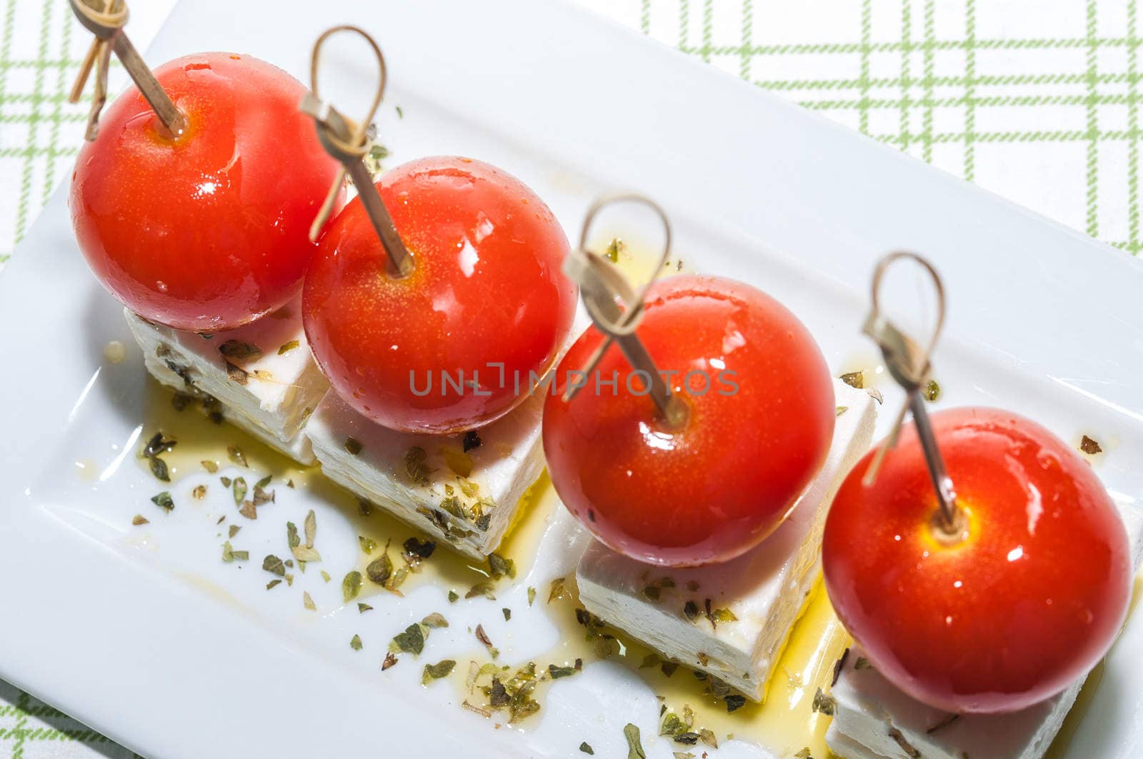 Cherry tomatoes with feta cheese, olive oil and oregano