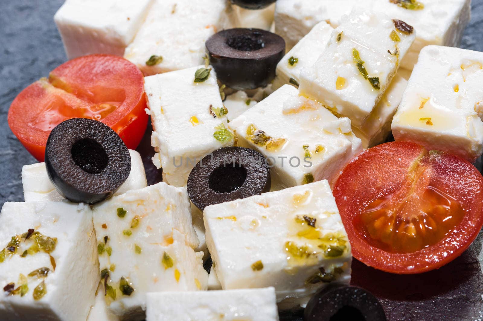 Feta cheese salad with black olives and cherry tomatoes