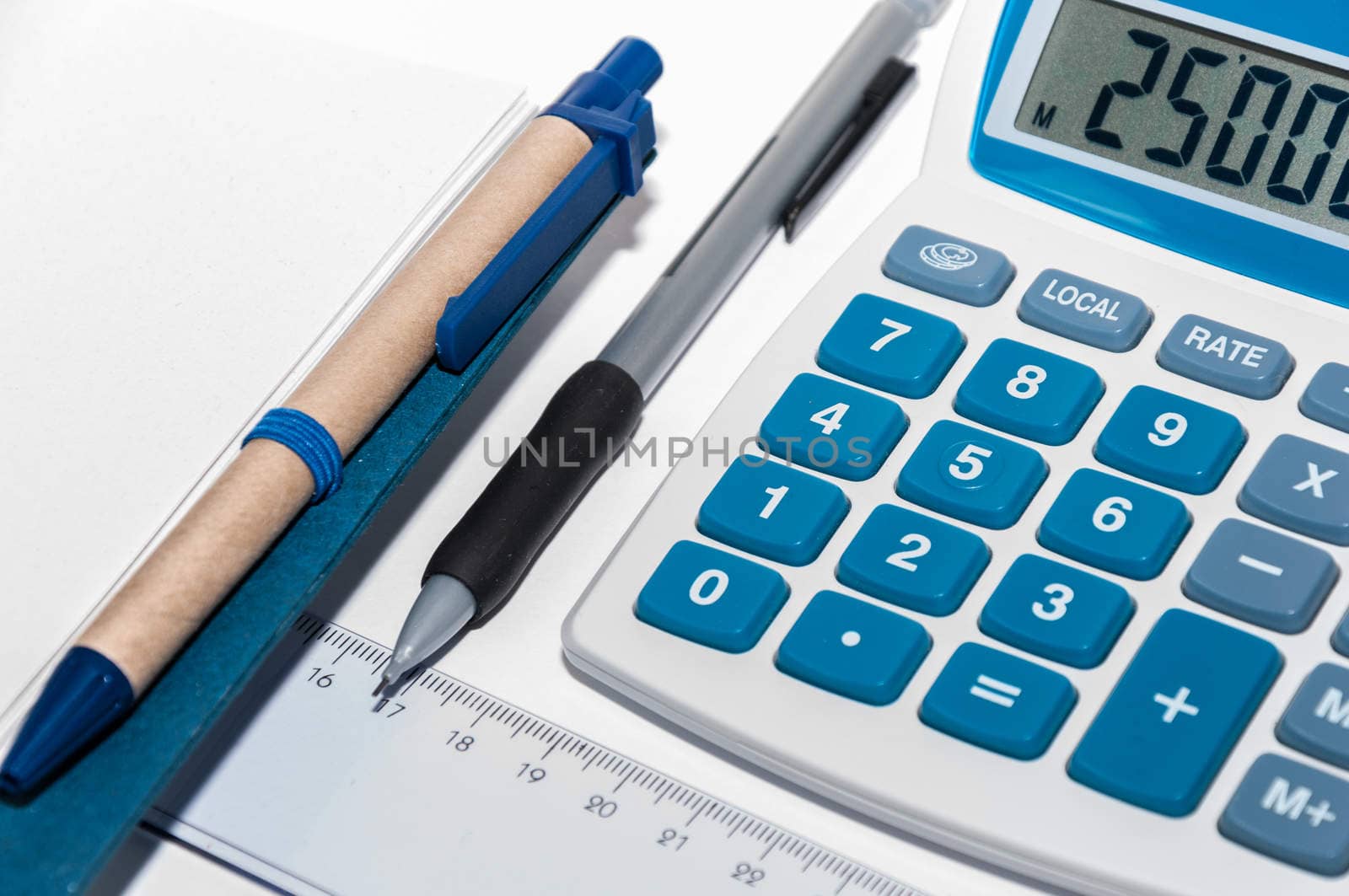 Notebook, pen and calculator on a white background