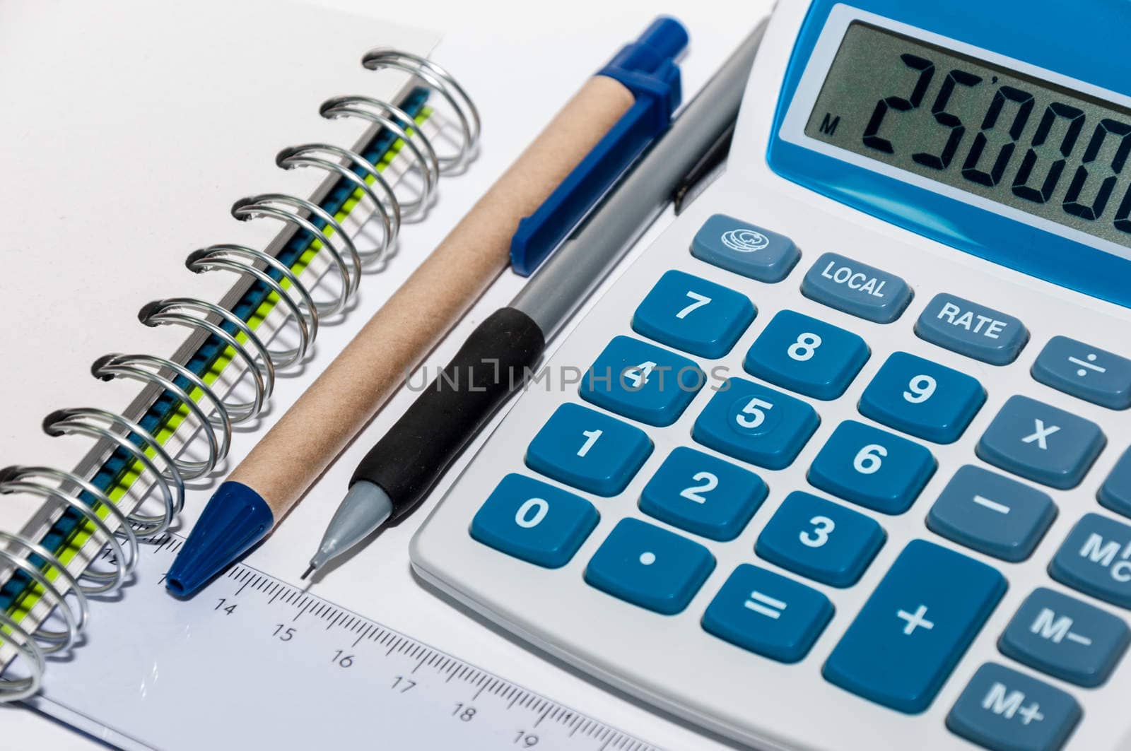 Notebook, pen and calculator on a white background