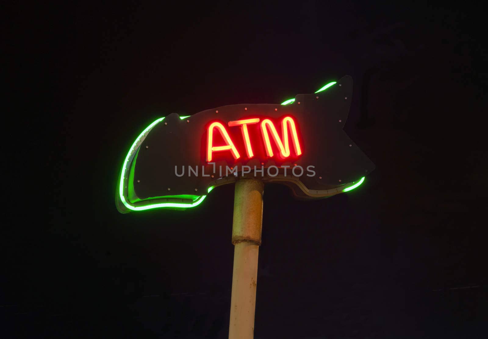 Neon ATM sign isloated on black background by brians101