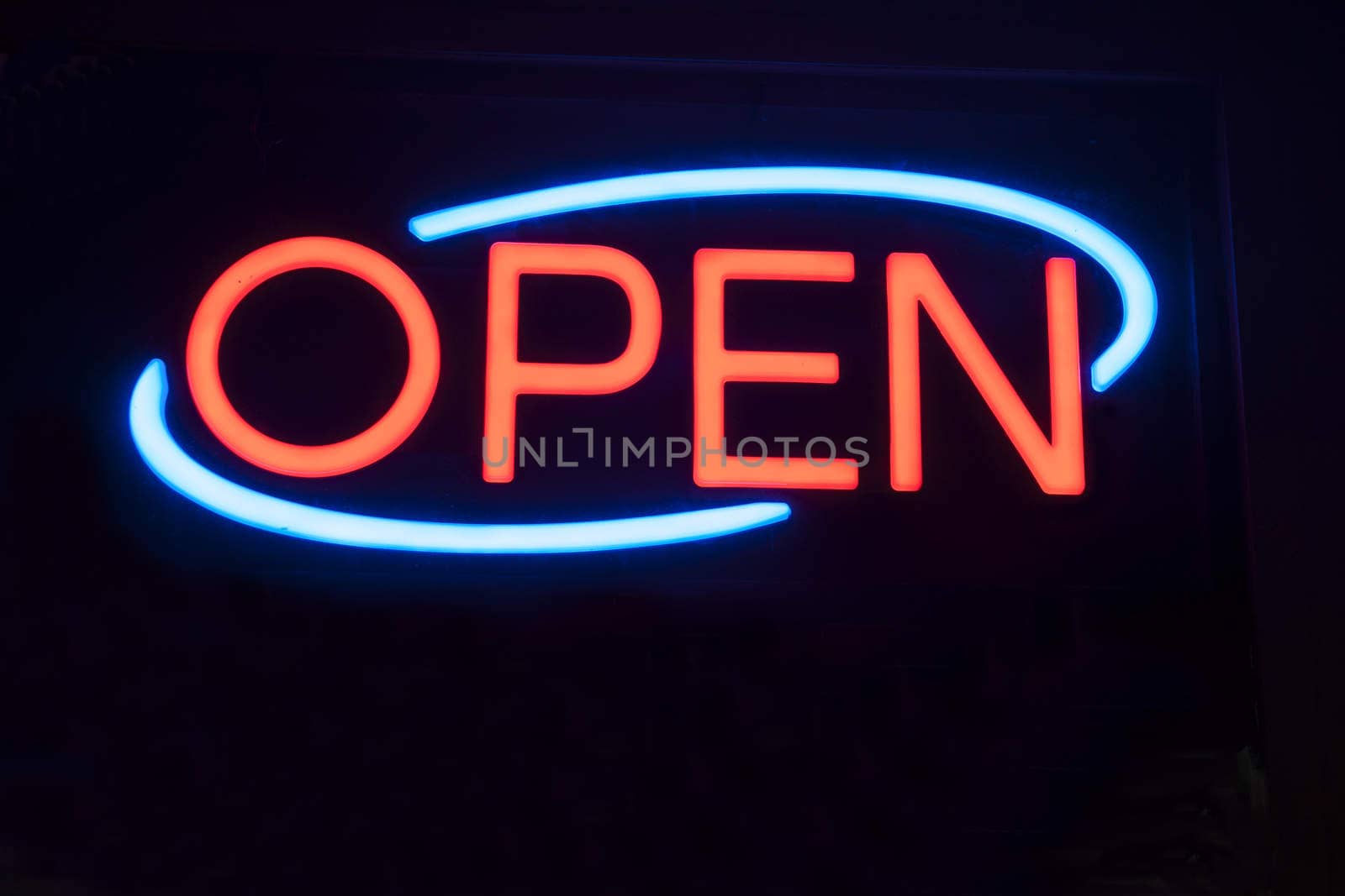 Neon Open sign against black background. by brians101