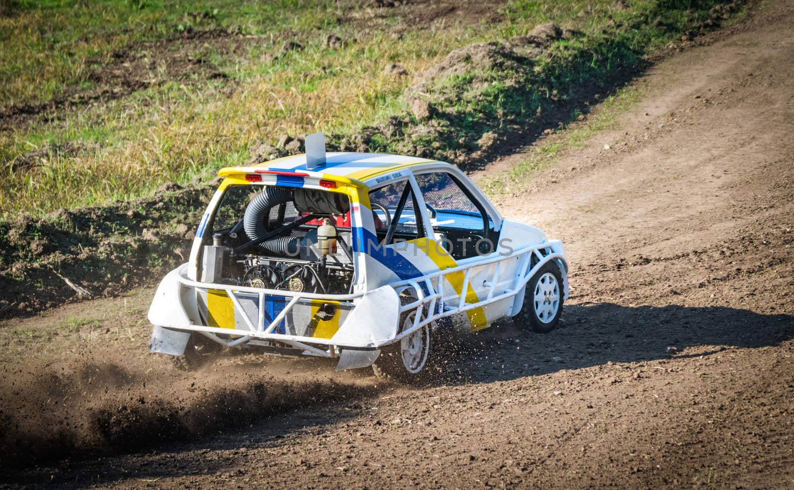 Car during a "stock car cross" race. The league called "stock car cross" foresees the use of tuned cars on unpaved circuits.