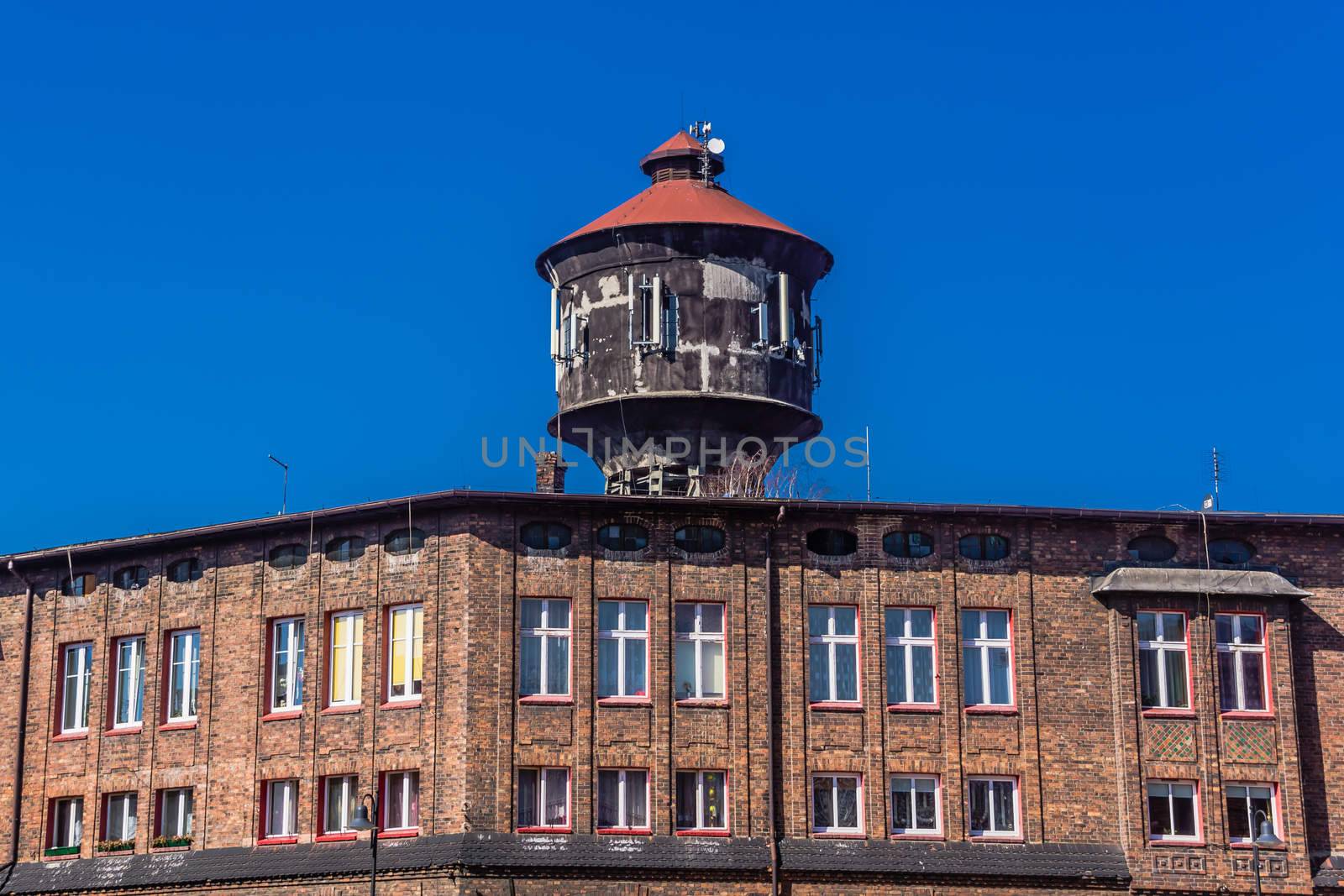 Old water tower in Nikiszowiec, district of Katowice, Silesia region Poland, on March 17, 2013. The place is unique historic coal miners' settlement, built between 1908–1918.