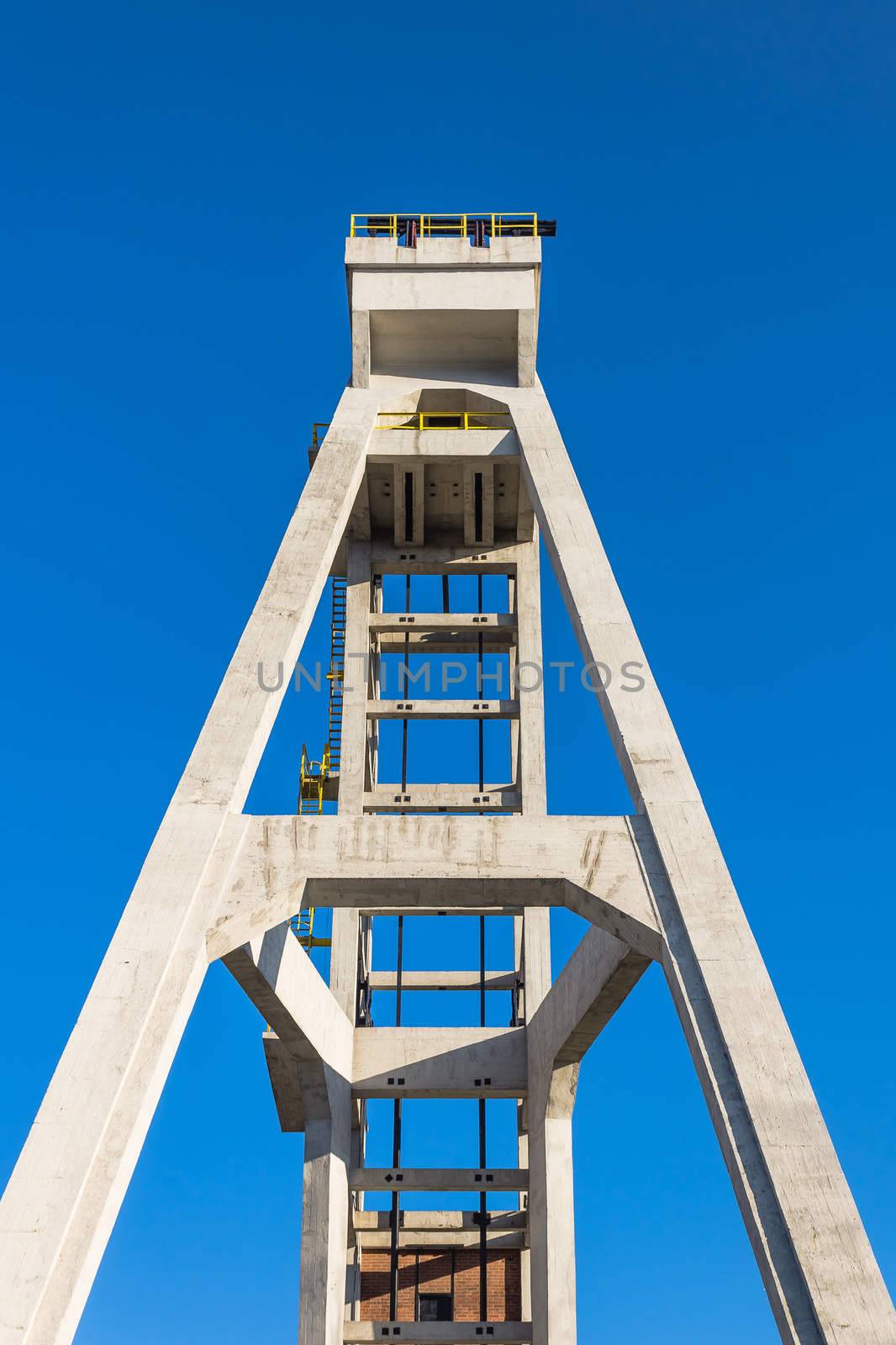 Fron view of historic hoist tower of the former "President" mine shaft in Chorzow, Silesia region, Poland. The mine shaft was in use until 1933.