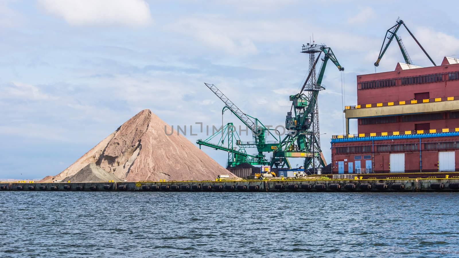 Heap of gravel on the quay, on July 10, 2013, in the Port of Gdynia - the third largest seaport in Poland, specialized in handling containers, ro-ro and ferry transport.