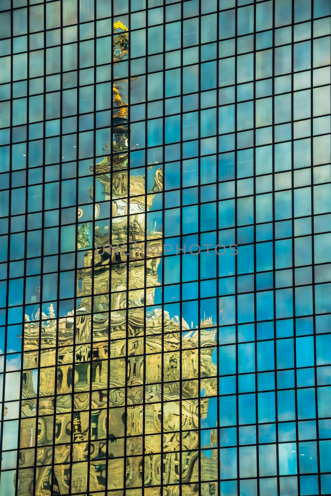 Palace of Culture and Science reflected in the widows of Marriott hotel, on March 01, 2013. Both buildings are the most recognizable landmarks of the capital of Poland.