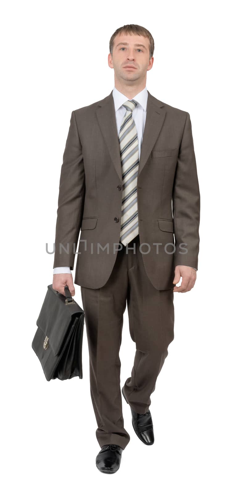 Businessman walking forward on isolated white background