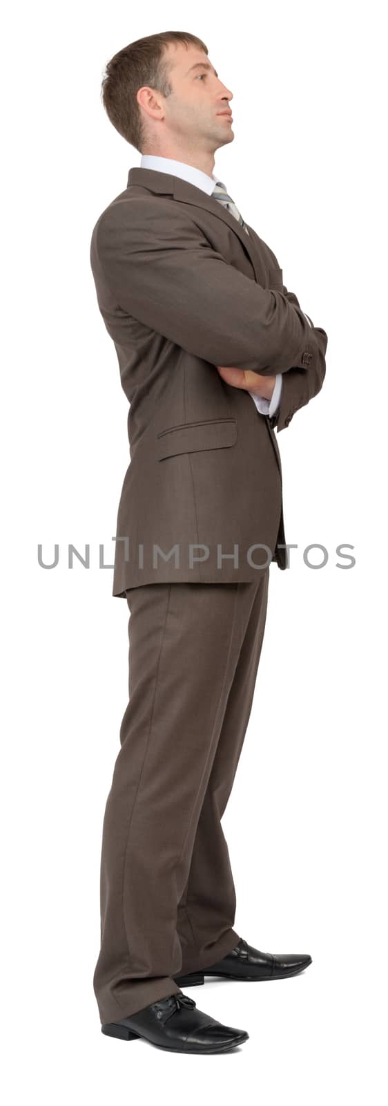 Businessman standing on isolated white background, side view