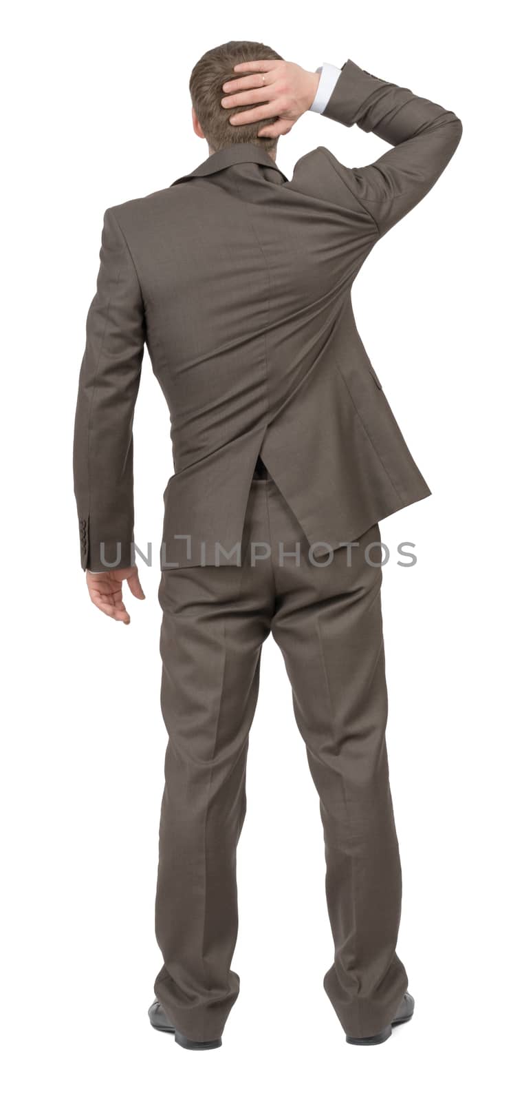 Thinking businessman on isolated white background, rear view