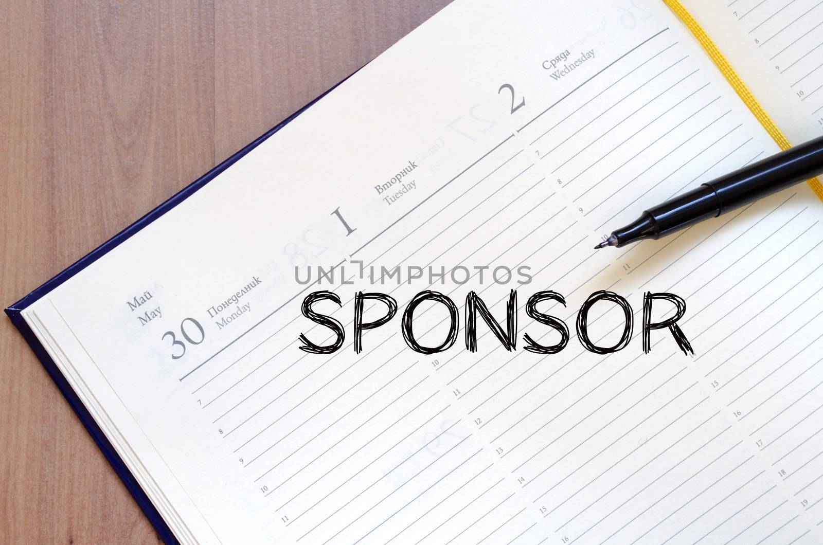 Sponsor text concept write on notebook with pen