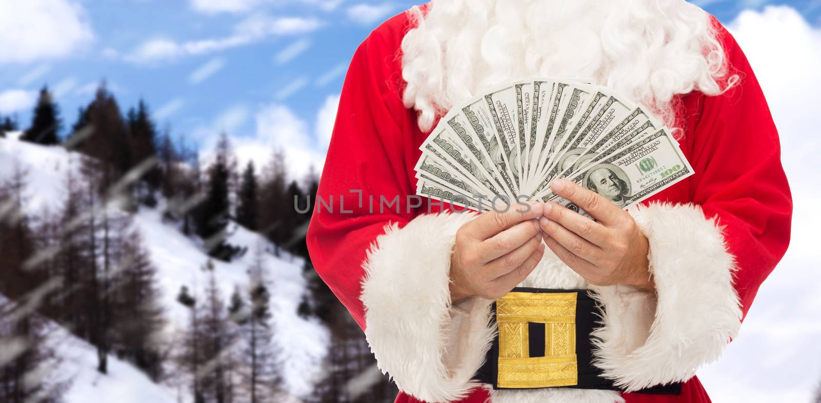 christmas, holidays, winning, currency and people concept - close up of santa claus with dollar money over snowy mountains