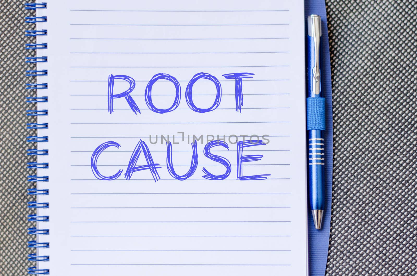 Roor cause text concept write on notebook with pen