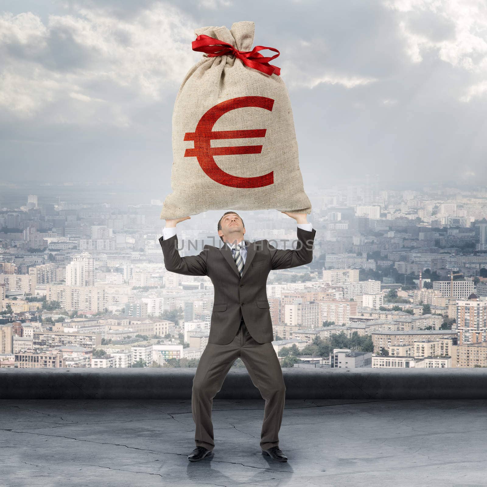 Businessman holding big moneybag with euro sign by cherezoff