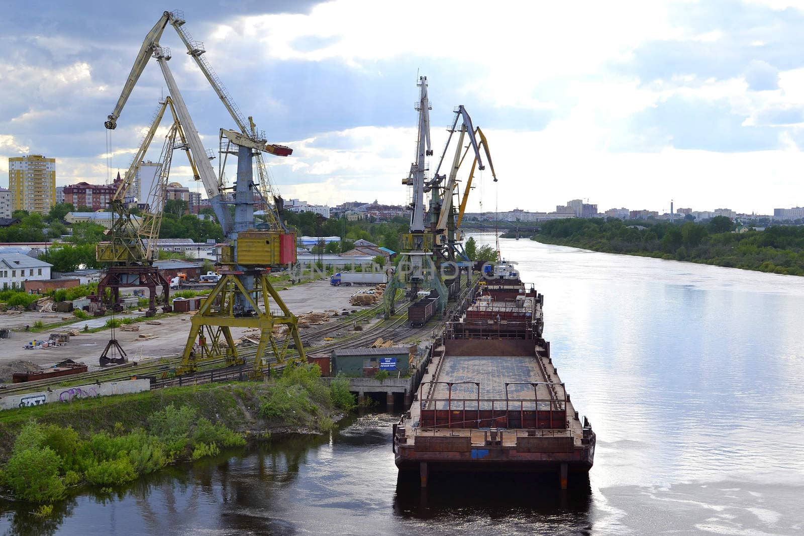 River port on the Tura River in Tyumen, Russia by veronka72