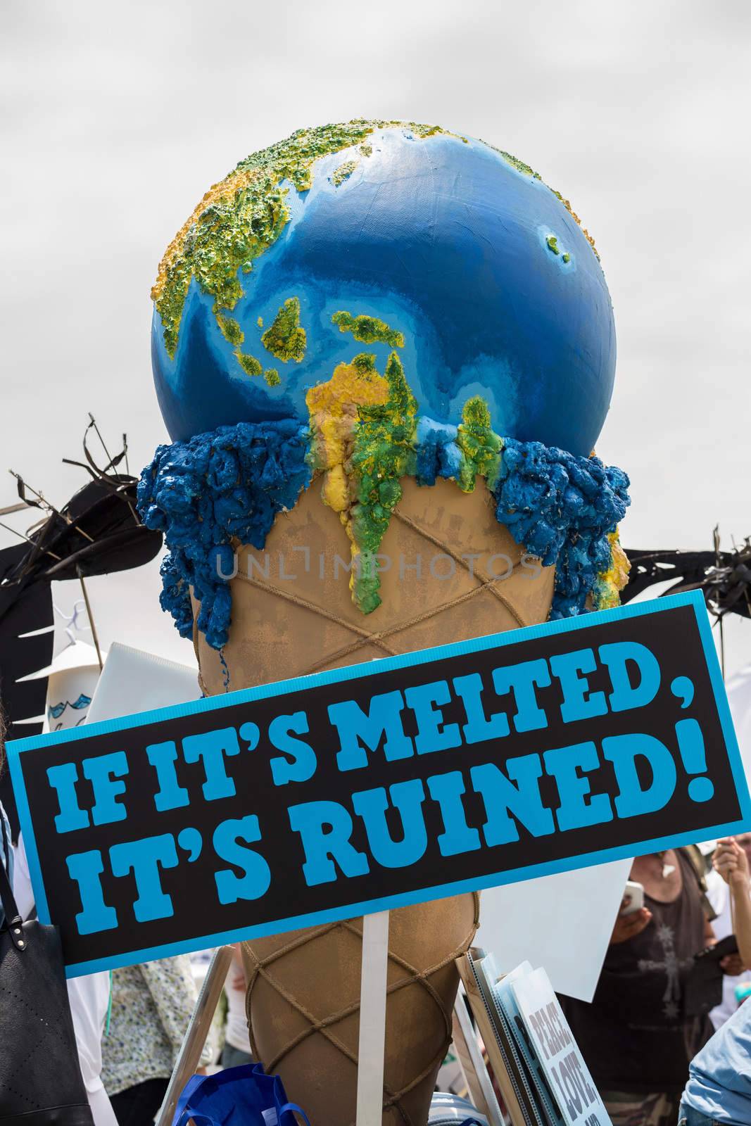 AUSTRALIA, Sydney: The earth as an icecream cone is shown as tens of thousands of Sydney protesters call for a focus on the cost of climate change to Pacific Islands on November 29, 2015, just ahead of the COP21 conference on climate change.  Australia's climate-sensitive neighbours in the Pacific were the focus for the climate change rally in Sydney as representatives of communities from Pacific nations of Tuvalu, Nauru, Kiribati and Tonga attend the march from the Domain to Circular Quay.  Climate change rallies rolled on across Australia over the weekend in Melbourne, Darwin, Brisbane and an unusually high turnout marches in Canberra.  