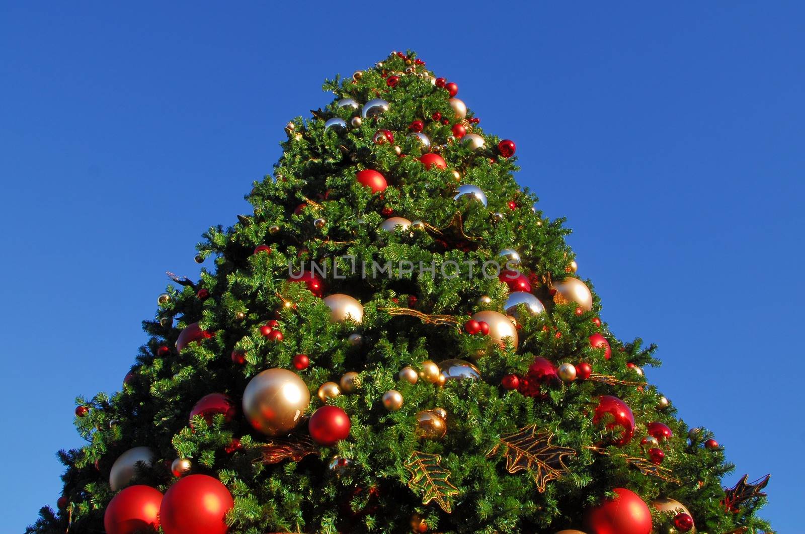 Big Christmas tree decorated with baubles and ornaments