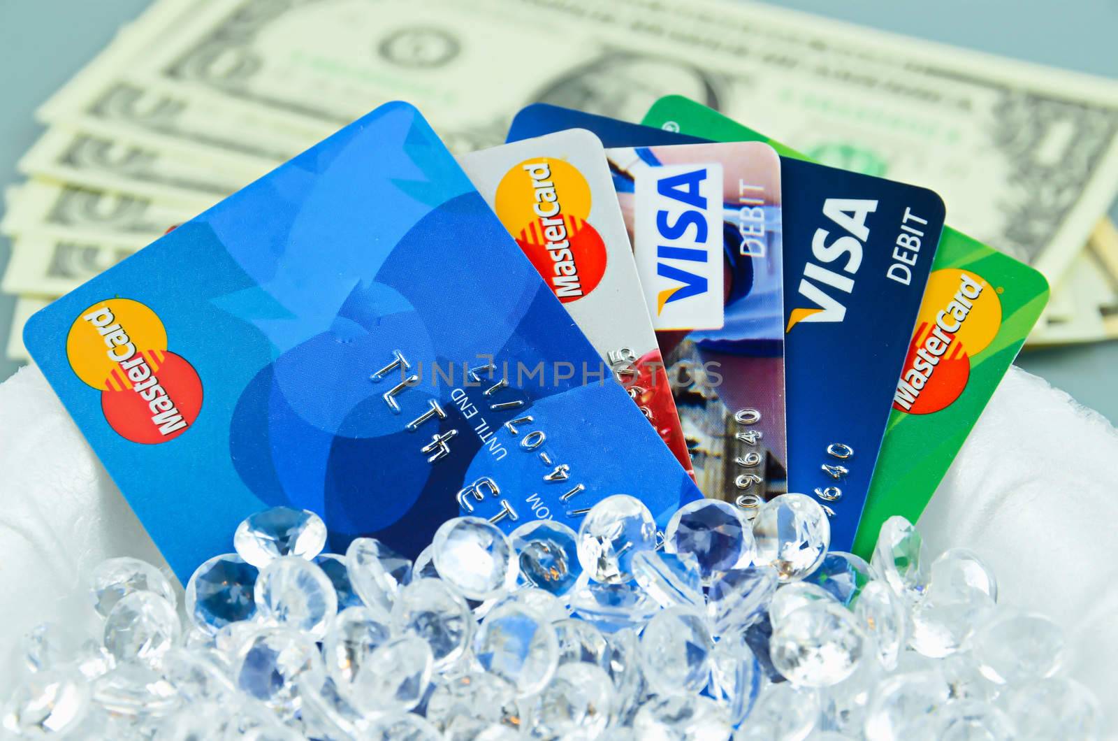 Credit cards closeup with money, diamonds and dollars, shallow dof
