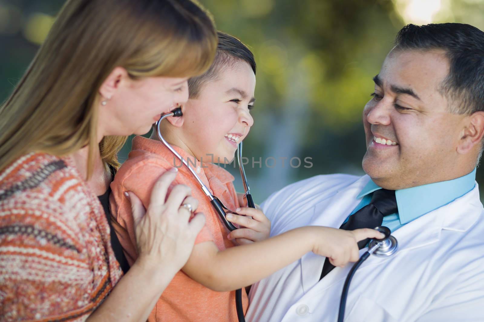 Mixed Race Boy, Mother and Doctor Having Fun With Stethoscope by Feverpitched