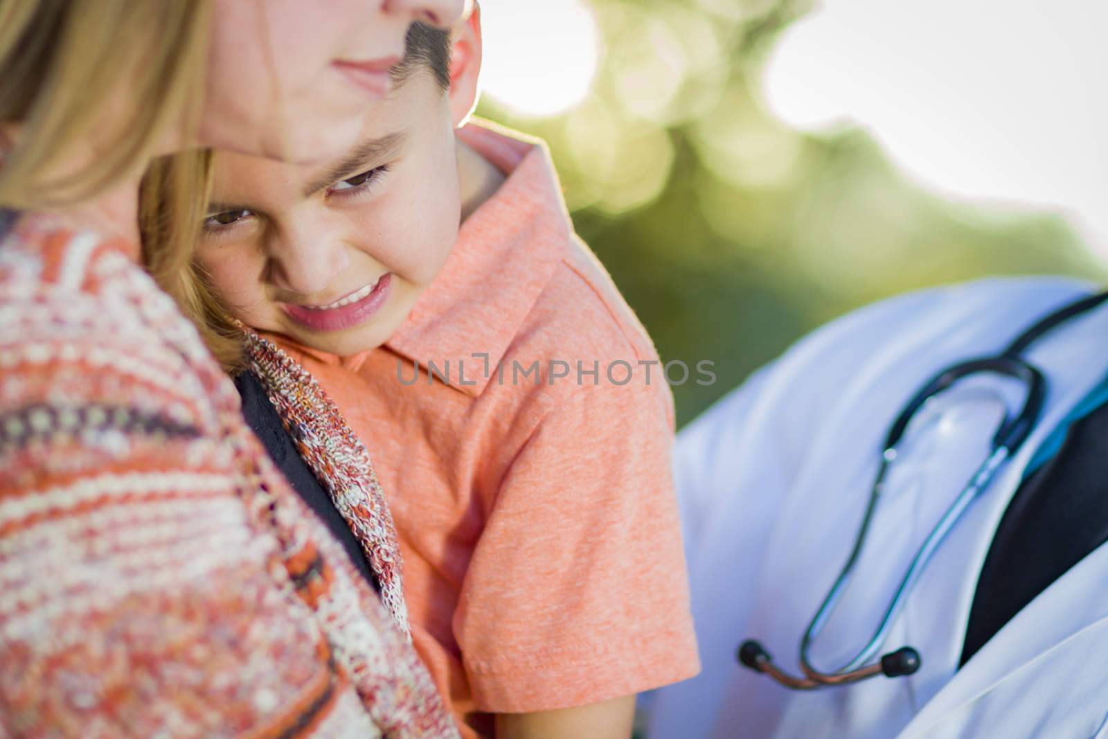 Sick Mixed Race Boy, His Mother and Hispanic Doctor Outdoors.