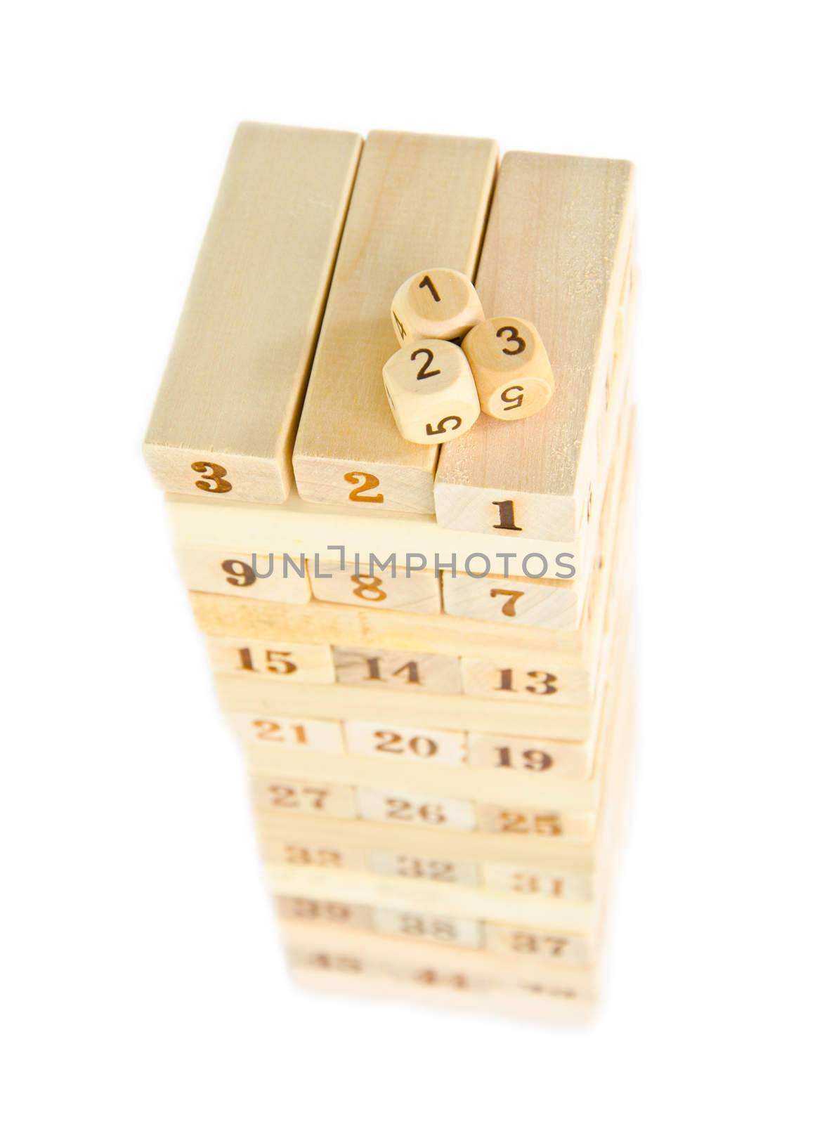Wooden block tower game on white background.