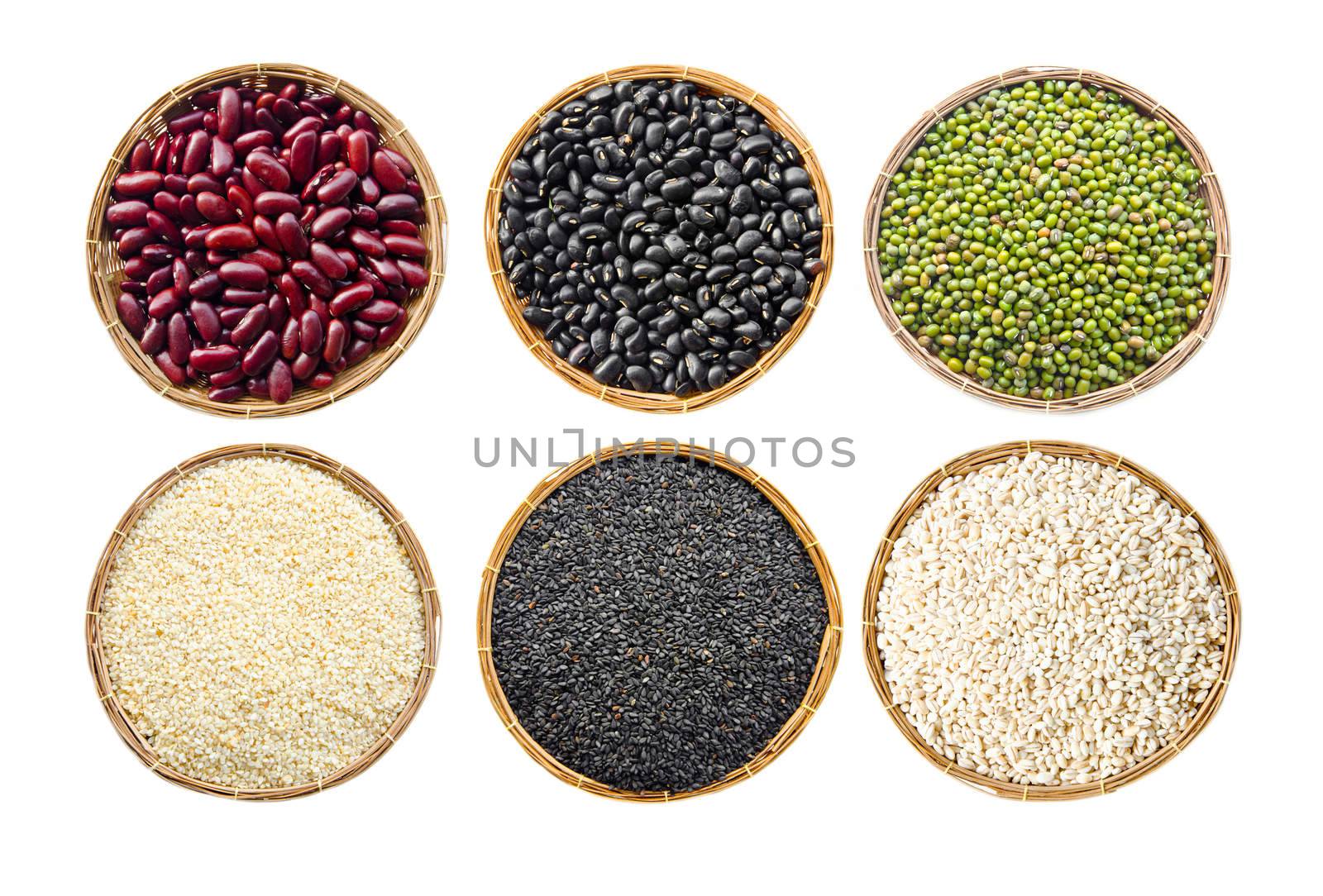 set of cereals seeds beans, red beans, black beans, green beans, sesame, black sesame, barley grit, in weave basket on white background.