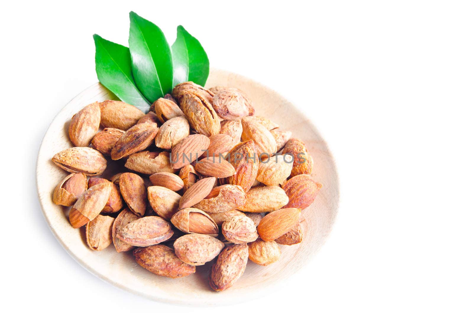 Almonds, walnuts and hazelnuts in wooden bowls