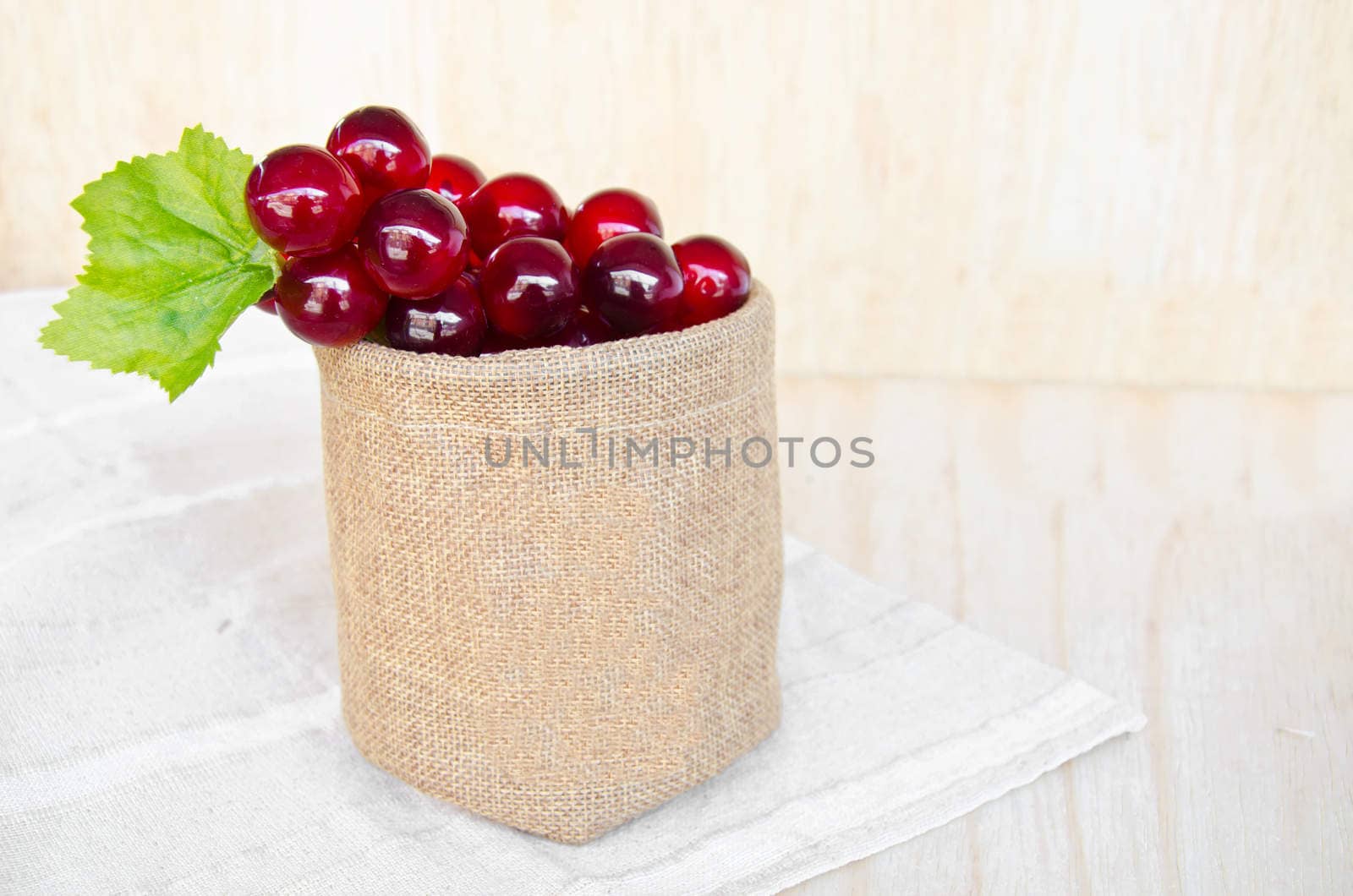 grapes in sack bag on wooden
