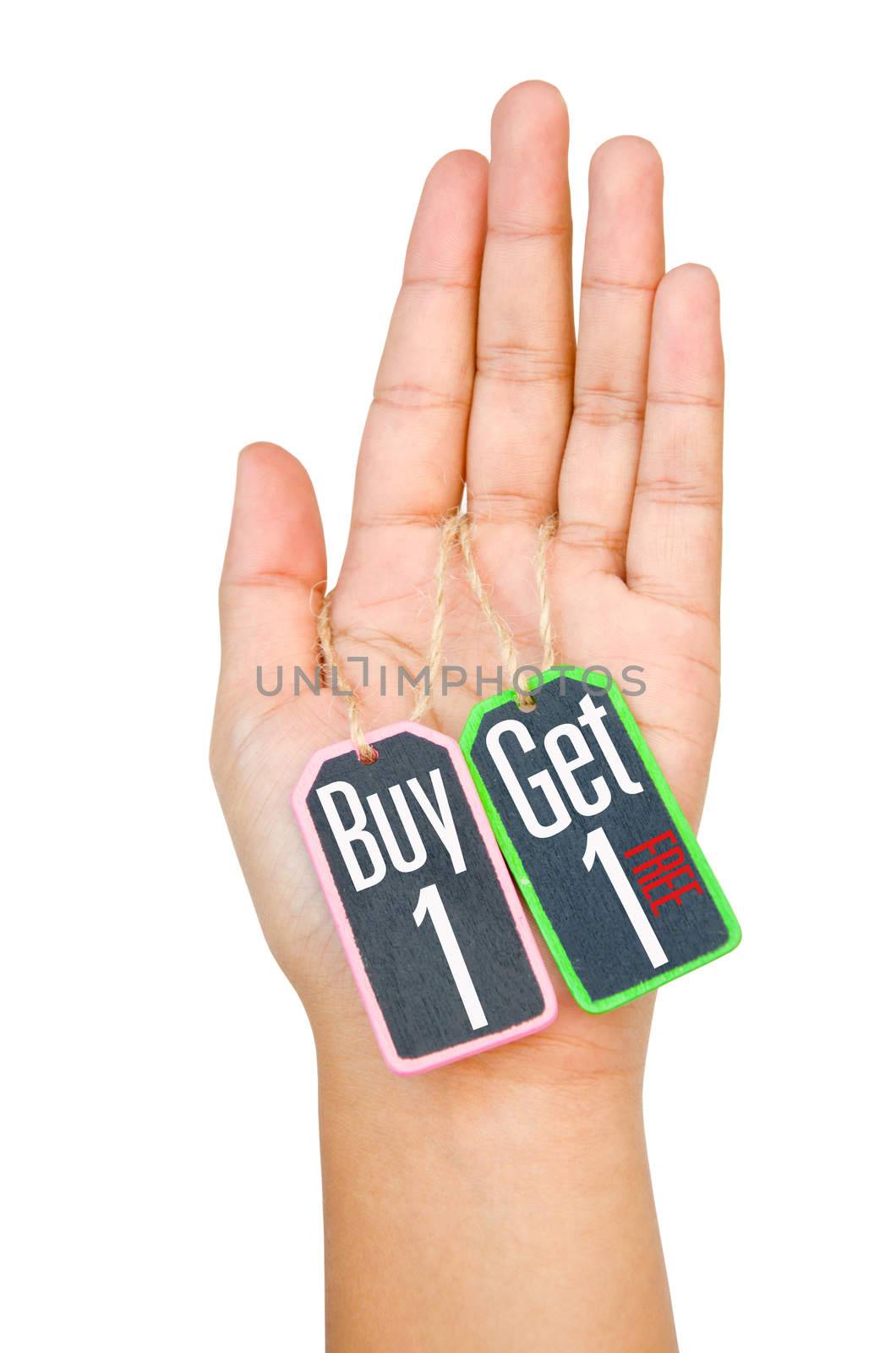 Buy 1 Get 1 label tag on women hand isolated on white background. clipping path.