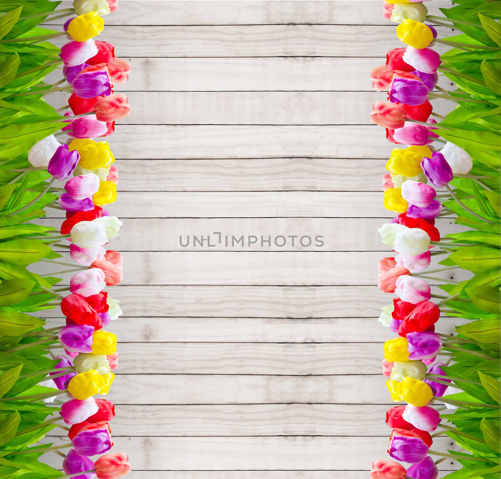 Bouquet tulip flowers on wooden wallpaper background.