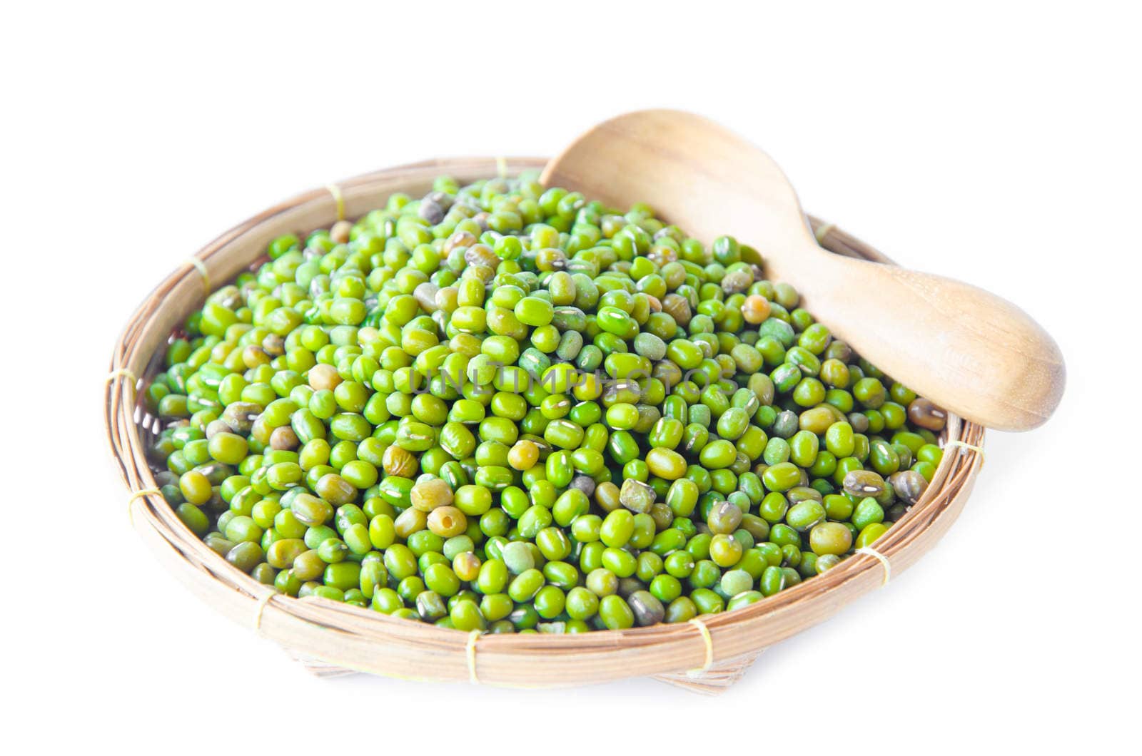 Green mung beans in weave basket on white background.