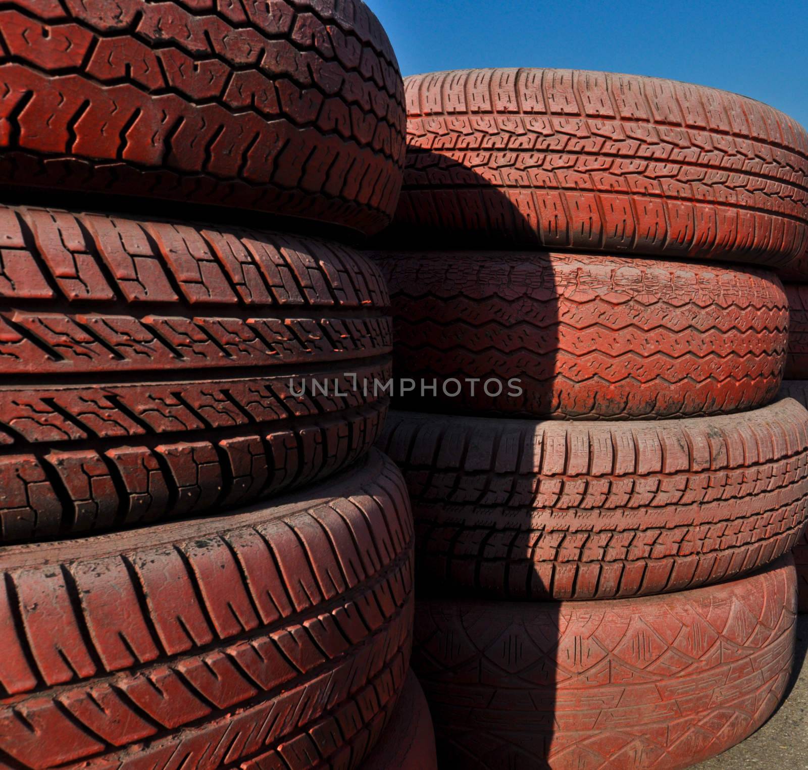 close up of racetrack fence of  red old tires