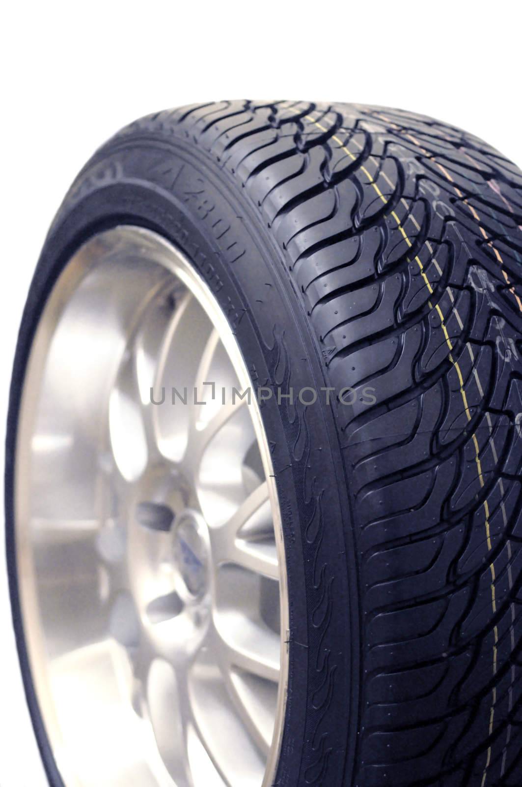 Low-profile car wheel on a white background close