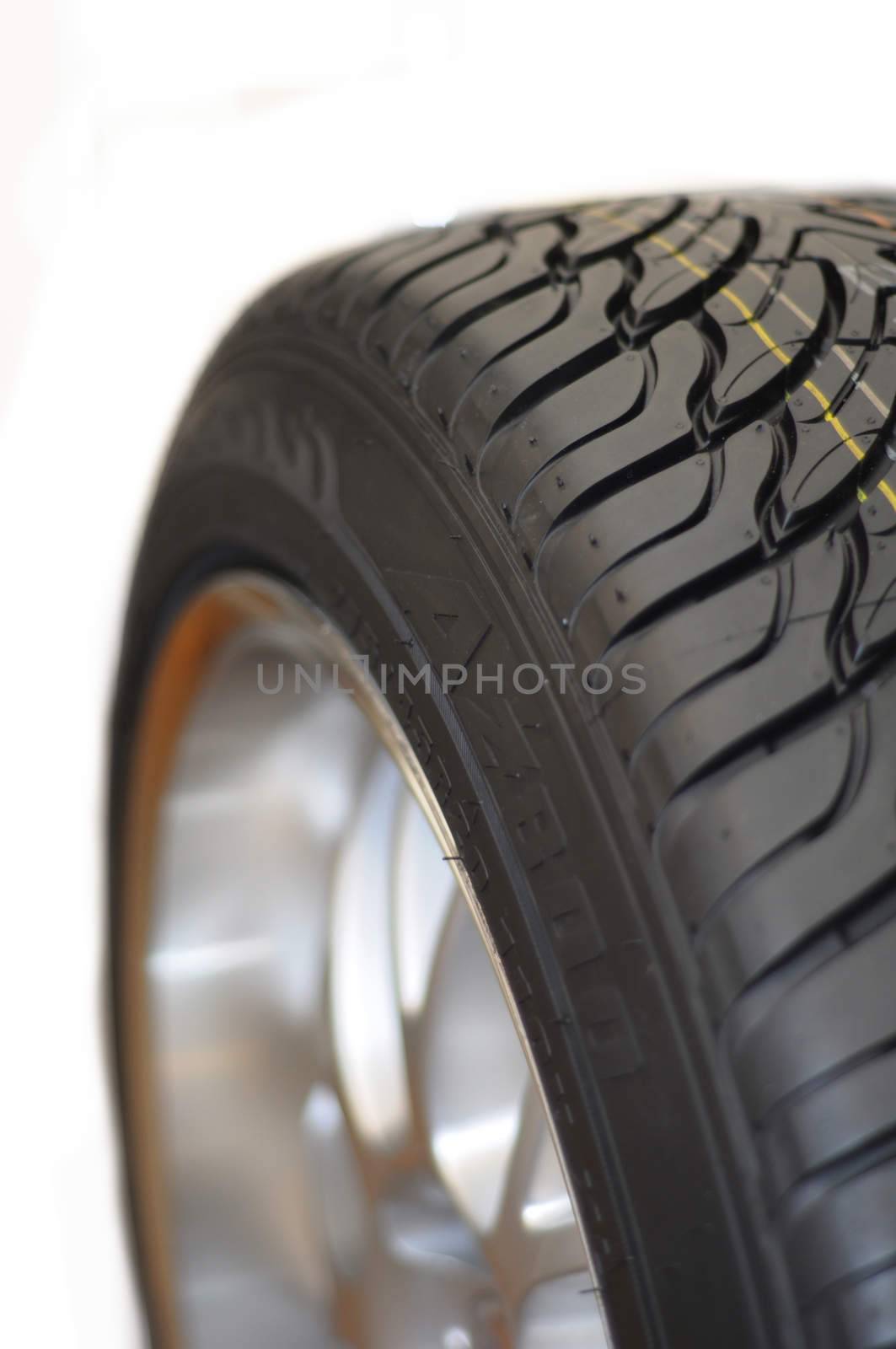 Low-profile car wheel on a white background close