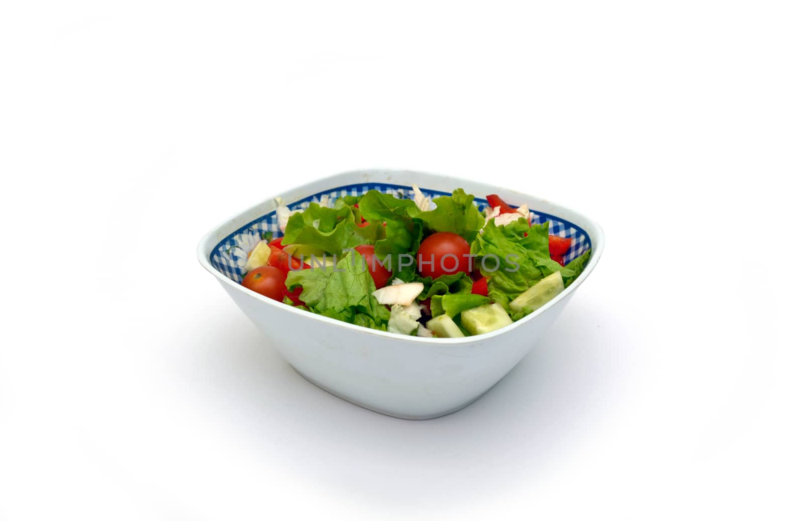 Vegetable salad from cucumbers, pepper, tomatoes, onions