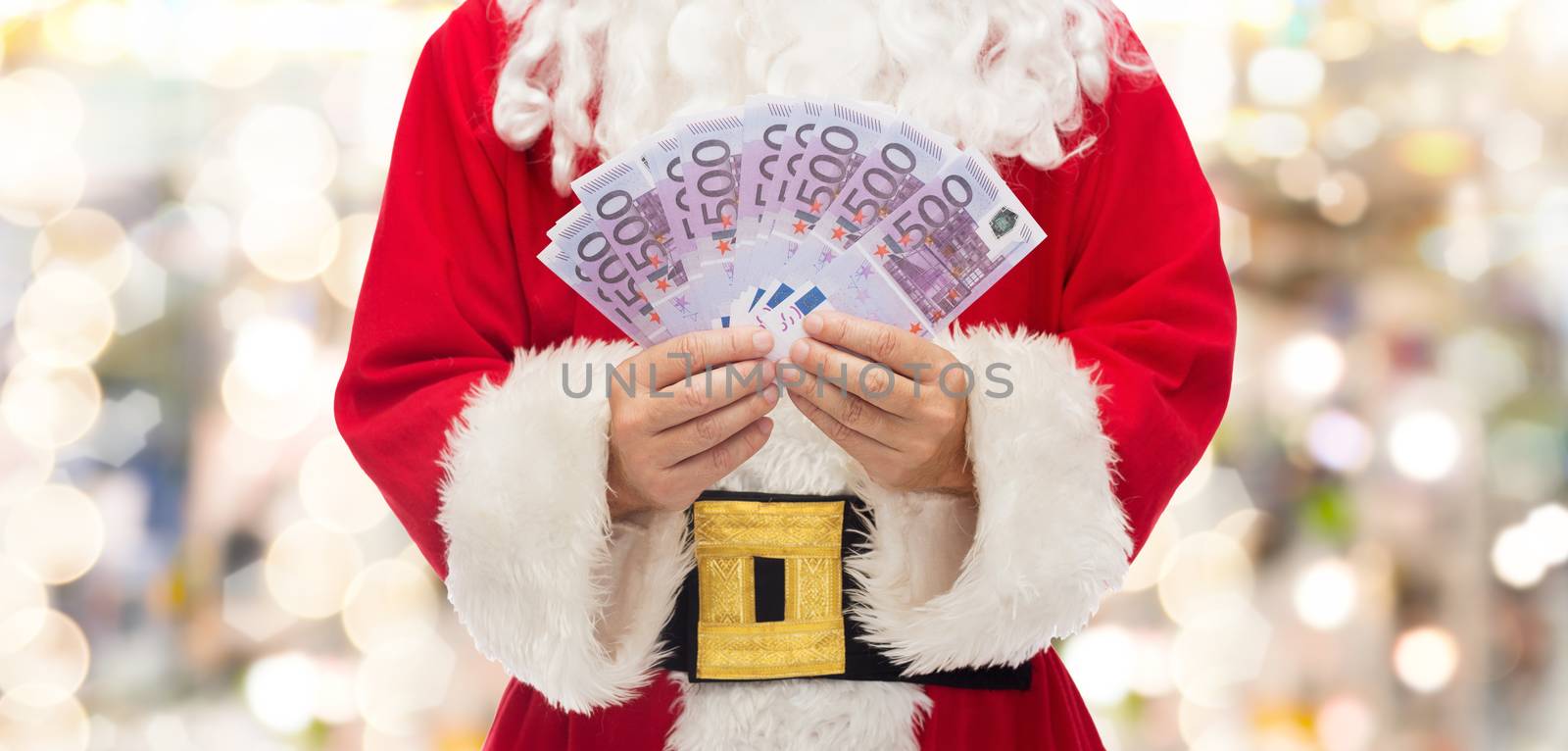 close up of santa claus with euro money by dolgachov