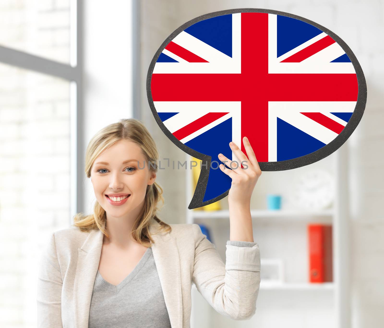 education, fogeign language, english, people and communication concept - smiling woman holding text bubble of british flag