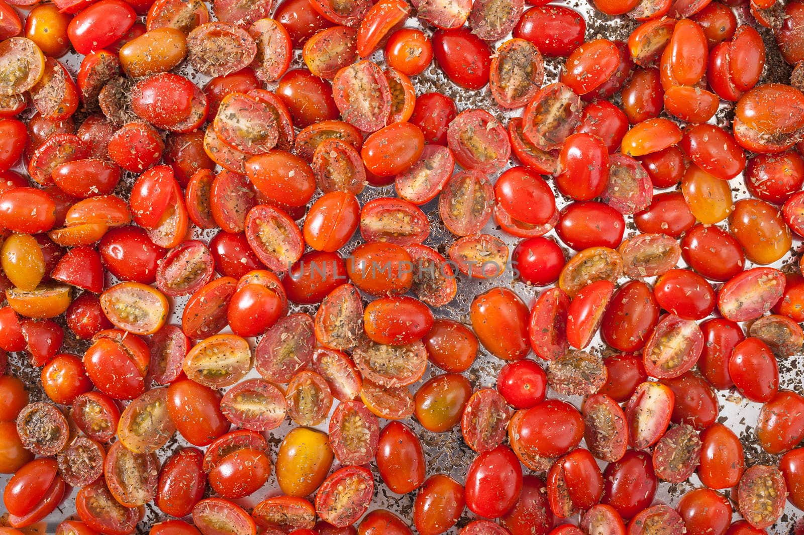 Cherry tomatoes with herbs preparing for dry out with sun light