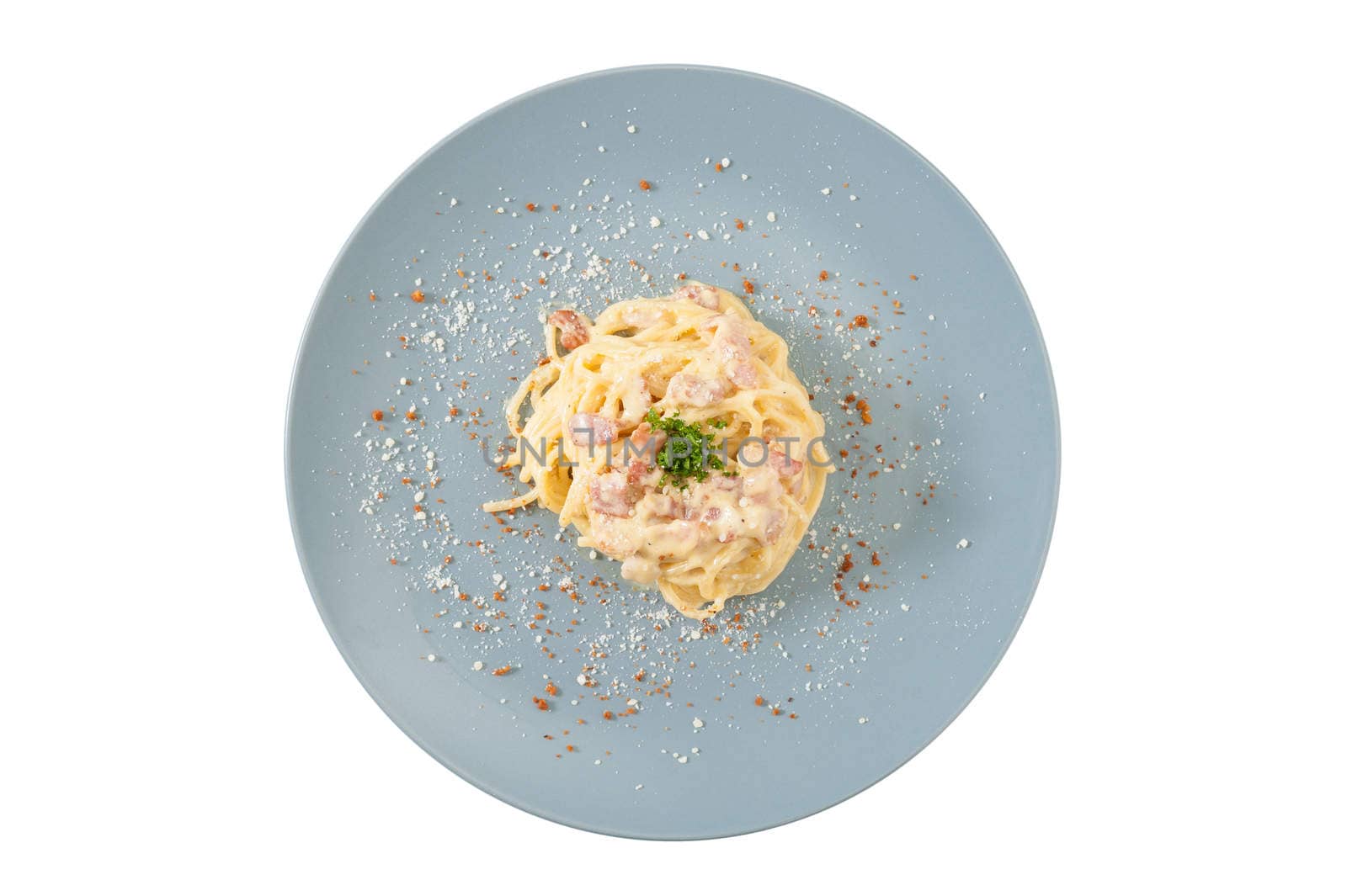 Carbonara pasta with bacon in grey ceramic dish isolated on white background with clipping path