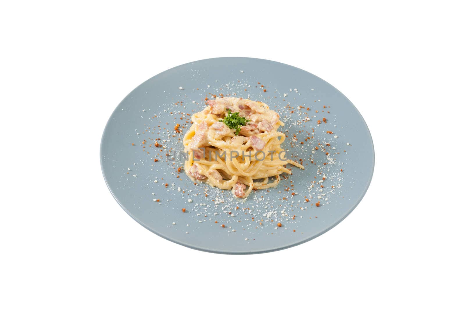 Carbonara pasta with bacon in grey ceramic dish isolated on white background with clipping path