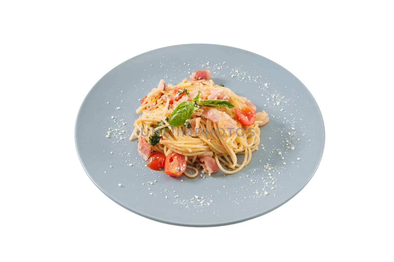 Pasta with bacon and tomato in grey ceramic dish isolated on white background with clipping path