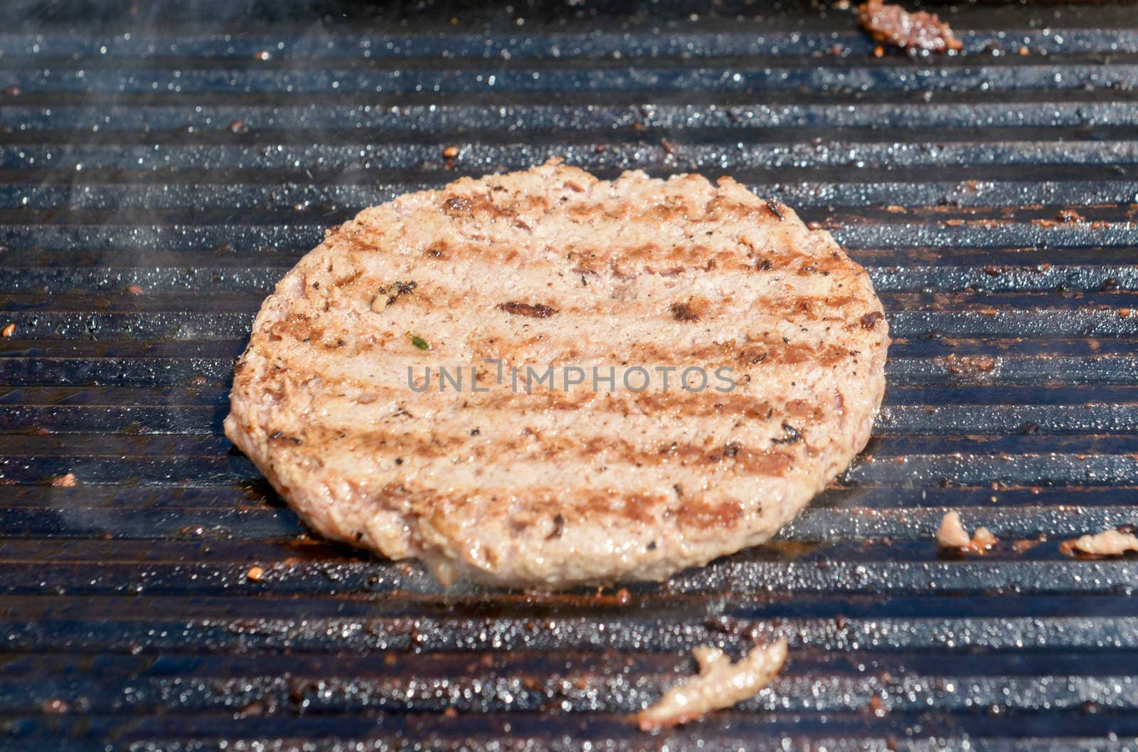 succulent grilled steak on a hot grill