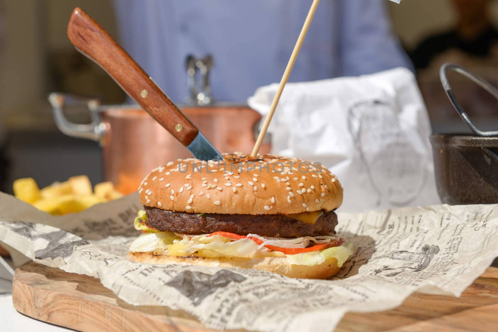 hamburger with a knife stuck in it