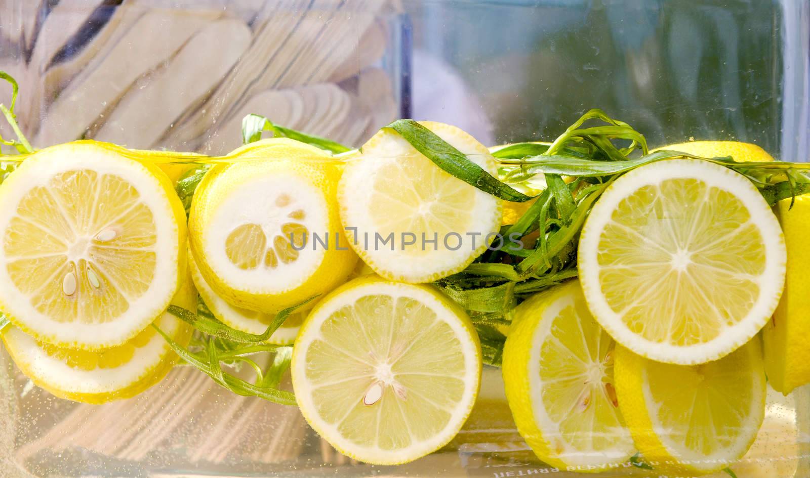 cold fresh lemonade with slices of lemon closeup