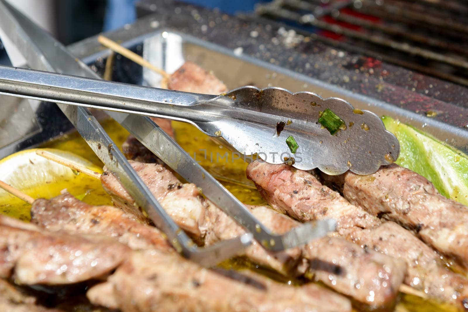 Juicy roasted kebabs on the metal tray by vlaru
