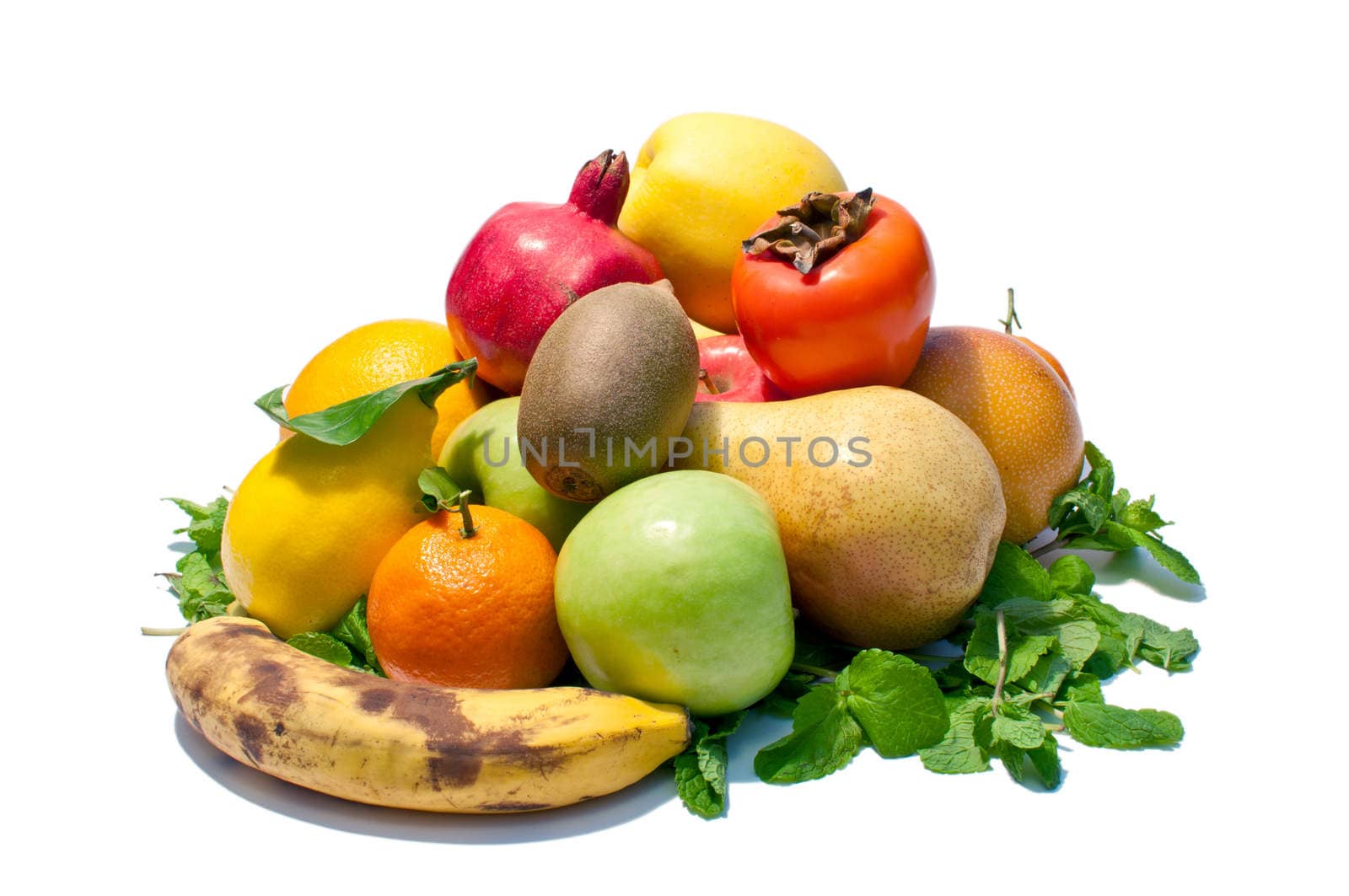 a lot of different fruits and green leaves on white background